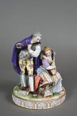 an image of a figurine of a man and a woman playing music