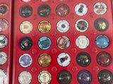 two red boxes filled with lots of different types of buttons
