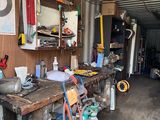 a garage with a lot of tools on the table