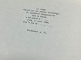an open book with a handwritten poem on it sitting on top of a table