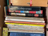 a box full of books that are stacked on top of each other