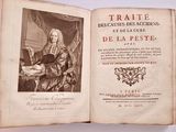 an open book with a picture of a man sitting at a table