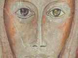 an image of a painting of a woman ' s face with yellow eyes