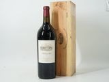 a bottle of wine sitting next to a wooden box