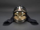 a helmet that is sitting on top of a black cloth