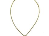 un collier composé d'une perle noire montée sur une chaîne en or
