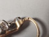 a close up of a gold ring with a skull on it