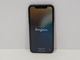 an iphone is sitting on a white surface with the word bonjouie on it