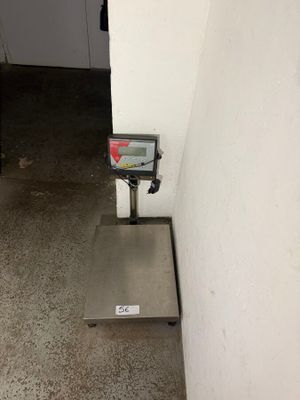 an image of a scale on the floor of a building