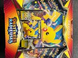 a box of pokemon cards sitting on top of a table