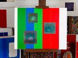 a picture of an easel with a painting on it in a room