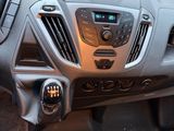 a dashboard of a car with a digital clock on it