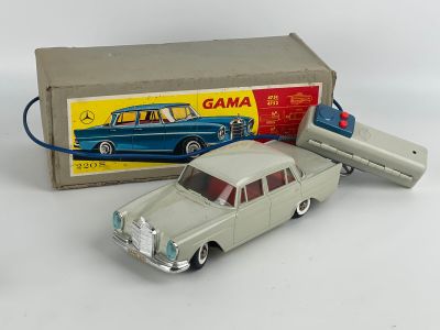 a toy car that is sitting in front of a box