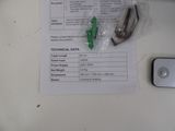 a piece of paper on the table next to a cell phone