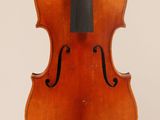 an old violin with a bow hanging from it ' s back