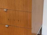 an image of a wooden chest of drawers on a hard wood floor