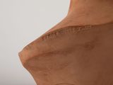 a close up of a clay bust of a woman