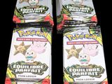 four packs of pokemon trading cards sitting on top of each other