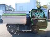 a small truck that is parked in a parking lot