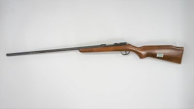 a rifle on a white background