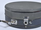 a black box with a handle on a white surface