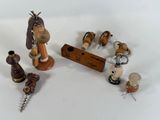 a lot of wooden figurines that are on the table