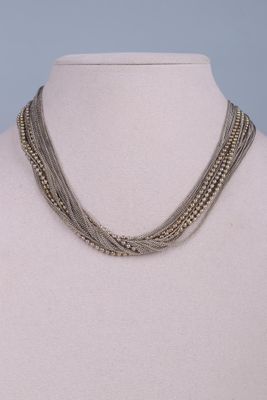 a close up of a mannequin necklace on a mannequin mannequin