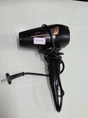 a hair dryer that is sitting on top of a table