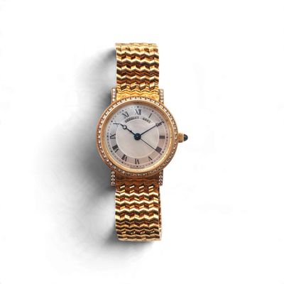 Montre-bracelet Cartier pour femme, en or 18 carats et sertie de diamants