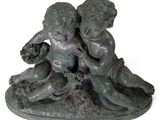 a statue of two children playing with a dog