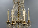 an image of a chandelier with three candles hanging from it