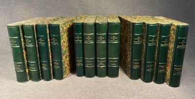 several green books stacked on top of each other on a table