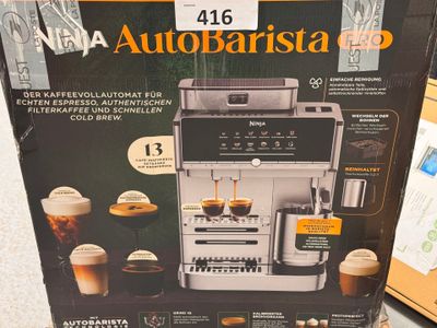 a box with a coffee machine inside of it