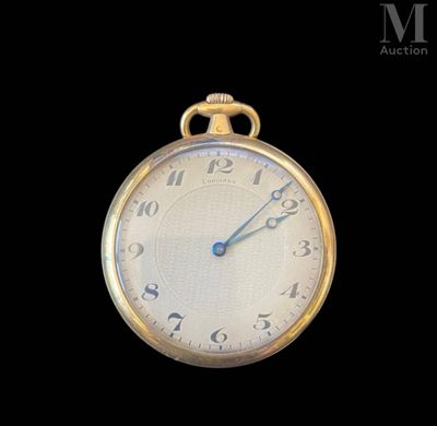 a close up of a gold pocket watch on a black background