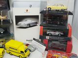 many different models of cars on display in a display case