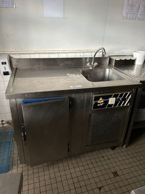 a kitchen with a sink and a stove in it