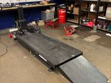 an image of a garage with a ramp in the middle of it