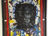 une image représentant une peinture du visage d'un homme sur un mur