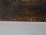 an image of a close up of a metal object on a table