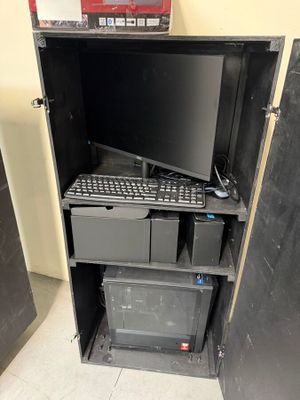 a computer that is sitting inside of a metal cabinet