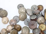 many different types of buttons on a white surface