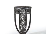 a black metal table with a glass top on a white background