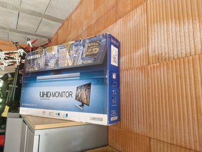 a box on top of a refrigerator in a room