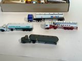 a box full of toy trains and trucks on a table