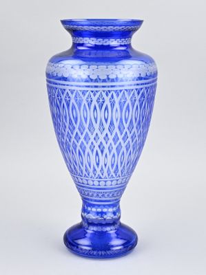 a blue vase that is sitting on a table