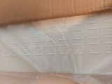 a close up of a box with a doughnut inside of it