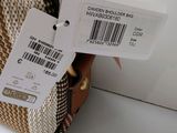 a bag with a price tag on it sitting on a table