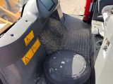 a close up of the driver ' s seat of a construction vehicle