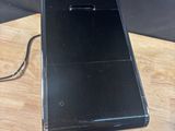 a cell phone that is sitting on top of a wooden table