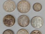 a close up of a bunch of coins sitting on top of a table